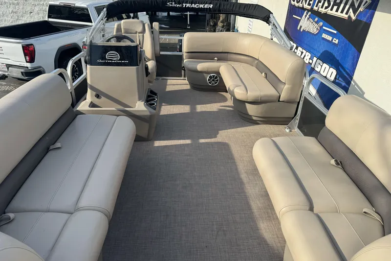Slide: The Image of 2024 Sun Tracker Party Barge 16 DLX interior with spacious seating and modern design. - 9