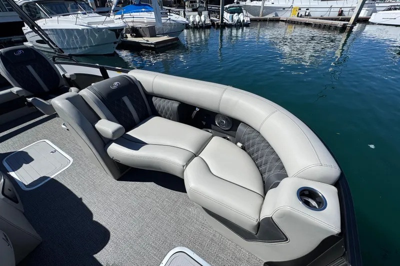 Slide: The Image of Luxurious seating on 2026 Barletta Lusso 23UC pontoon boat at marina. - 18