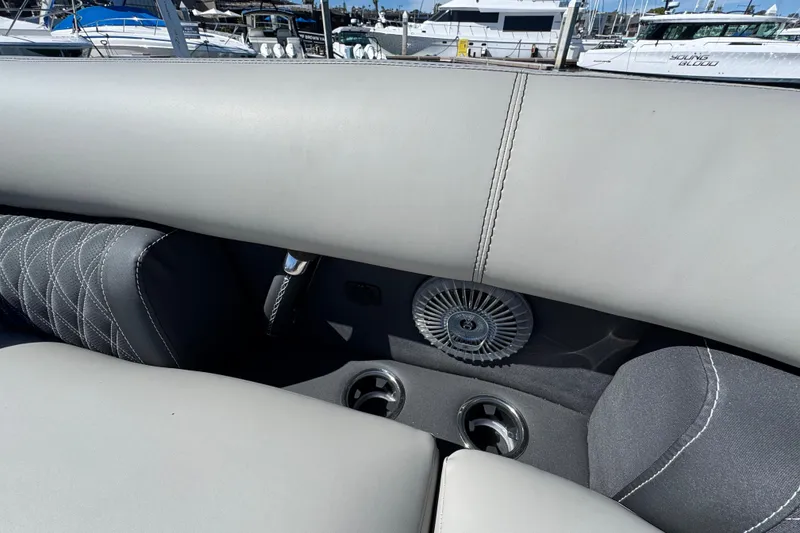 Slide: The Image of Interior of 2026 Barletta Lusso 23UC boat with luxurious seating and cup holders. - 21
