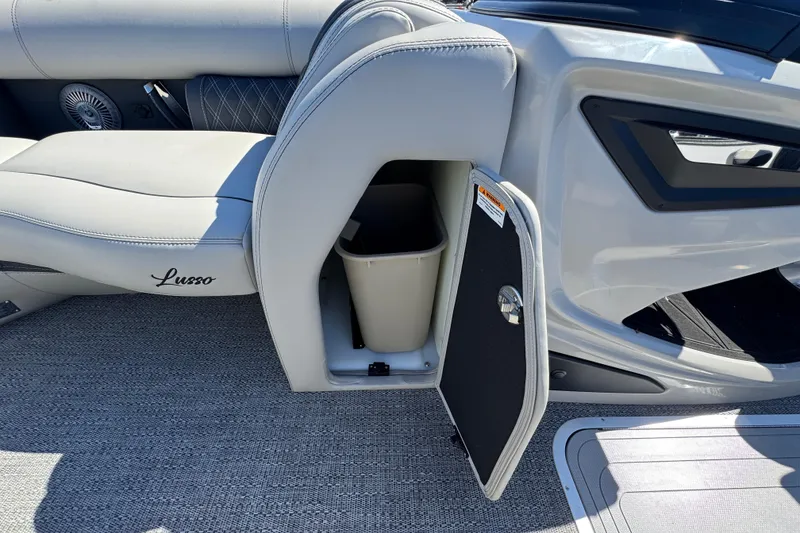 Slide: The Image of 2026 Barletta Lusso 23UC boat interior with storage compartment and seating. - 29