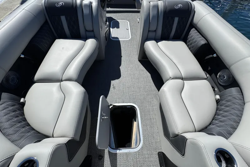 Slide: The Image of 2026 Barletta Lusso 23UC pontoon boat interior with luxurious gray seating and storage compartment. - 31