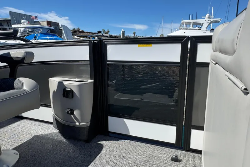 Slide: The Image of 2026 Barletta Lusso 23UC pontoon boat interior with seating and cup holders. - 36