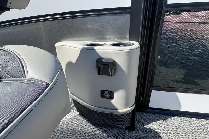 Slide: The Image of 2026 Barletta Lusso 23UC boat interior with cup holders and seating detail. - 40