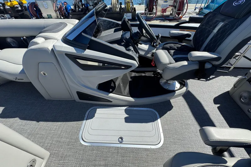 Slide: The Image of 2026 Barletta Lusso 23UC boat interior with modern helm and luxurious seating. - 42