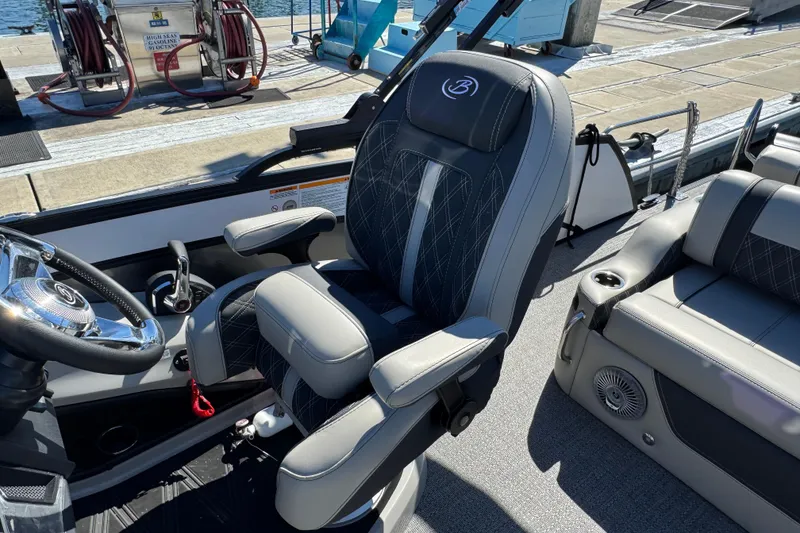 Slide: The Image of 2026 Barletta Lusso 23UC boat interior with luxurious seating and modern steering wheel. - 46