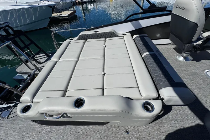Slide: The Image of 2026 Barletta Lusso 23UC boat interior with luxurious seating and cup holders. - 55