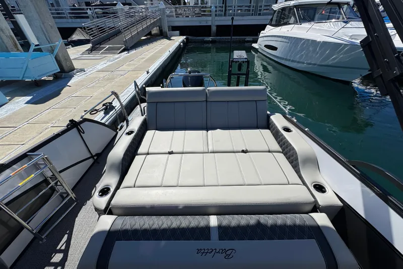 Slide: The Image of 2026 Barletta Lusso 23UC luxury boat interior at marina dock. - 57