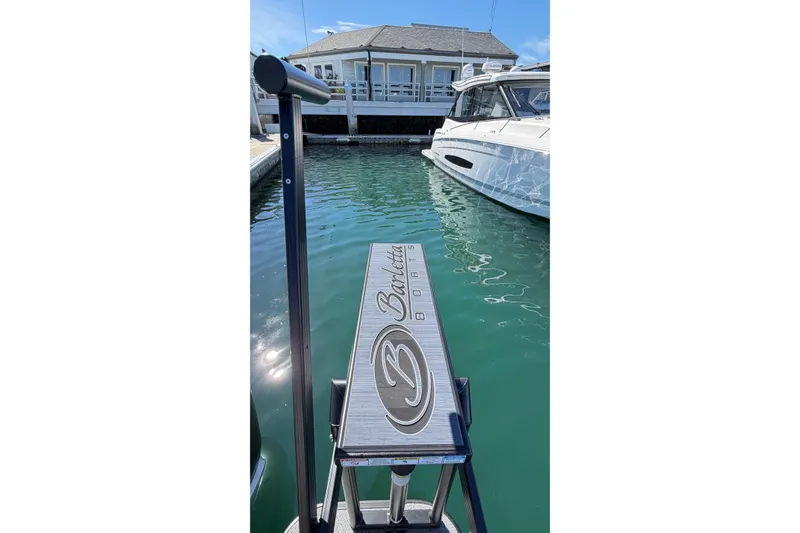 Slide: The Image of 2026 Barletta Lusso 23UC boat docked in marina, clear water, sunny day. - 64