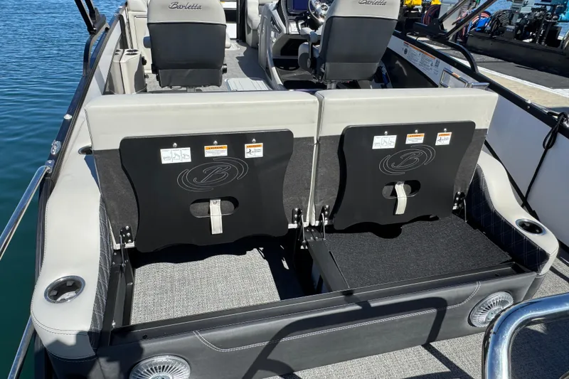 Slide: The Image of 2026 Barletta Lusso 23UC boat interior with seating and cup holders. - 66