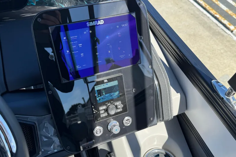 Slide: The Image of Control panel of 2026 Barletta Lusso 23UC boat with Simrad and JBL displays. - 88