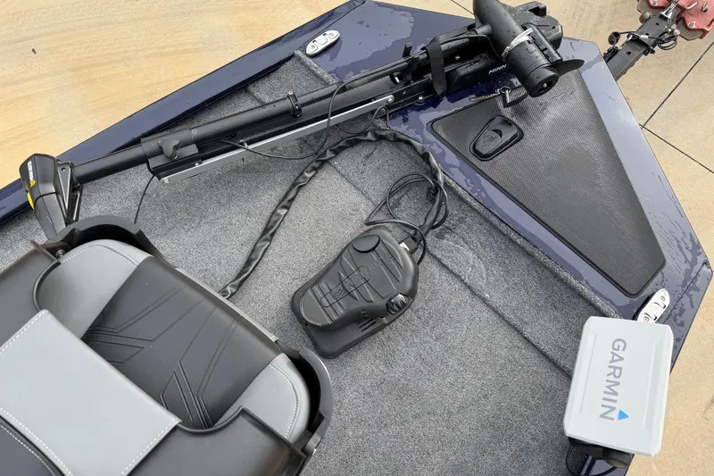 Slide: The Image of 2022 Bass Tracker Pro 170 boat interior with Garmin device and trolling motor. - 3