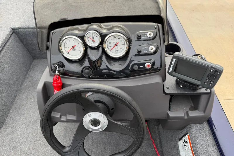 Slide: The Image of Bass Tracker Pro 170 dashboard with gauges and Lowrance fish finder, 2022 model. - 5