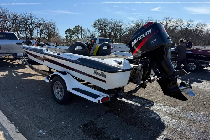 Slide: The Image of 2005 Bass Cat Pantera Classic boat with Mercury EFI engine on trailer in parking lot. - 11