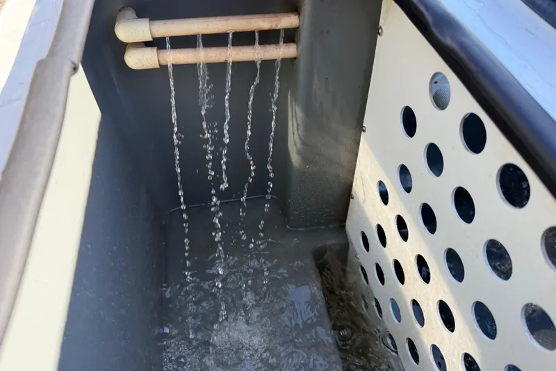 Slide: The Image of Livewell system in a 2005 Bass Cat Pantera Classic boat, water flowing through pipes. - 13