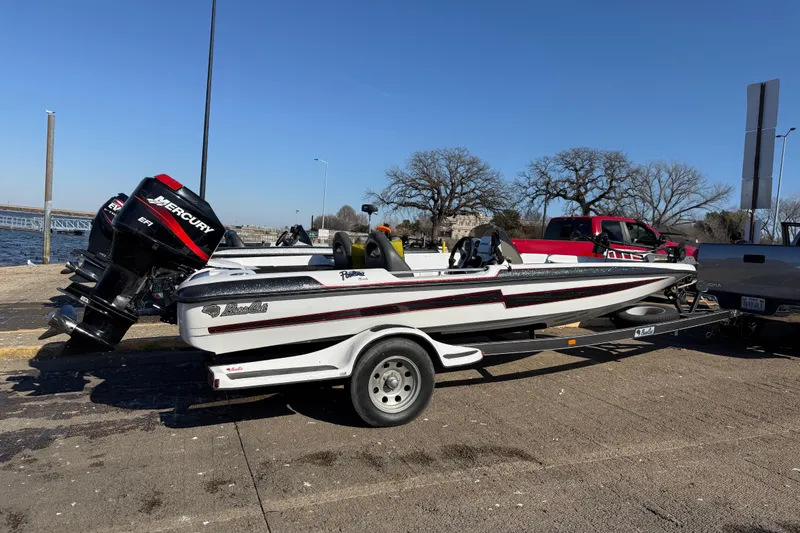 Slide: The Image of 2005 Bass Cat Pantera Classic boat on trailer near waterfront, with Mercury engine. - 5
