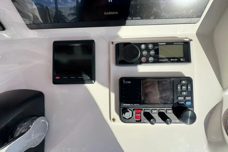Slide: The Image of Control panel of a 2017 Intrepid 375 Center Console with Garmin and Icom devices. - 12