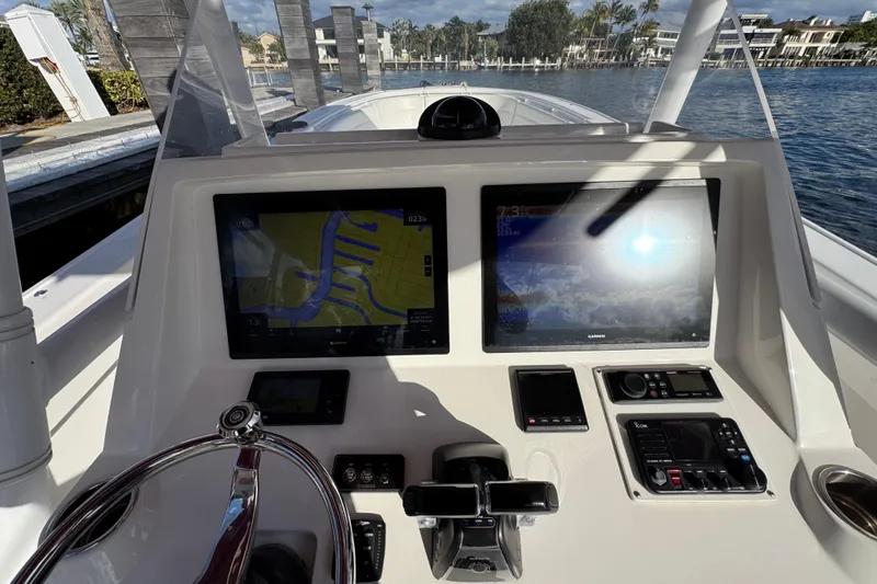 Slide: The Image of 2017 Intrepid 375 Center Console dashboard with navigation screens and controls. - 13