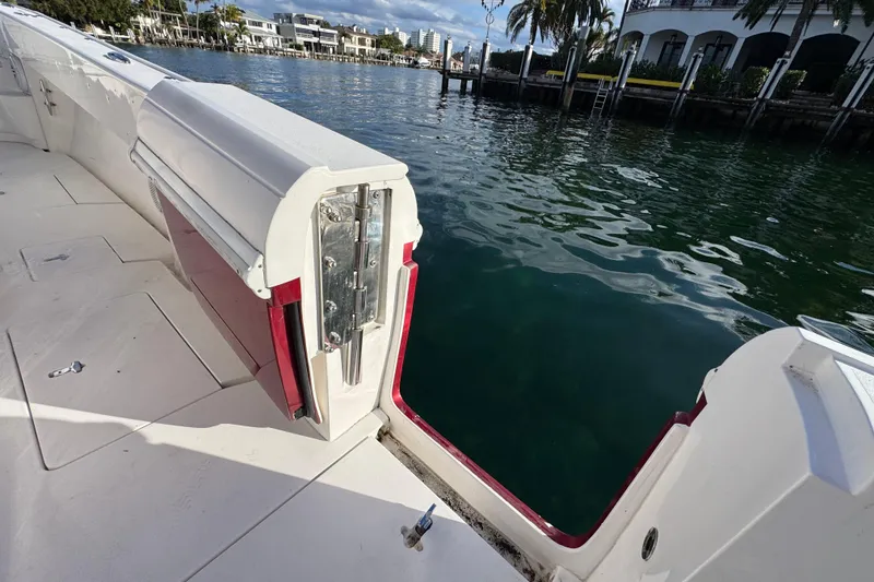Slide: The Image of 2017 Intrepid 375 Center Console boat with open side door, dockside view. - 23