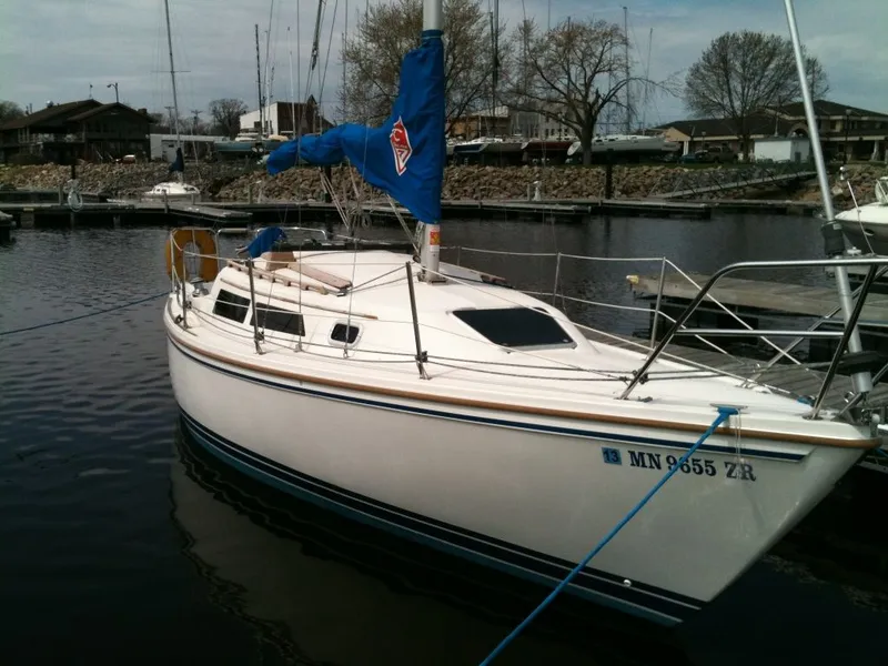 The Image of 1990 Catalina 27 sailboat docked in harbor. - 1