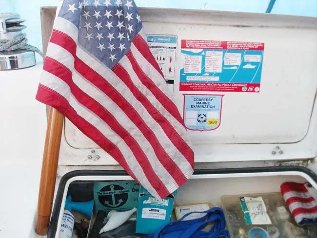 Slide: The Image of US flag on Catalina 27 boat, year 1990, with safety equipment. - 13