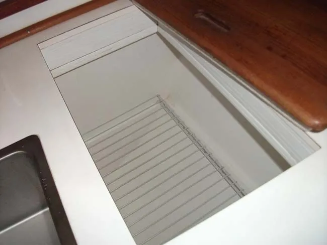 Slide: The Image of Interior of a 1990 Catalina 27 with wooden countertop. - 22