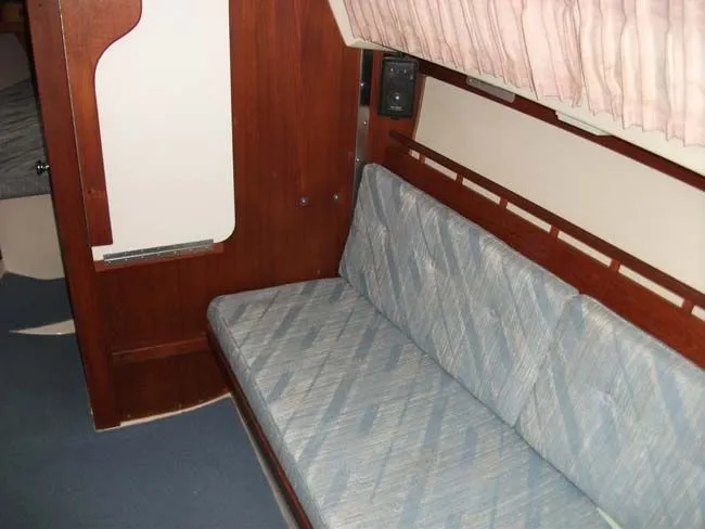Slide: The Image of Interior of a 1990 Catalina 27 yacht with blue upholstery. - 37
