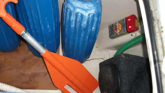 Slide: The Image of Boat accessories in storage compartment of a 1990 Catalina 27. - 39