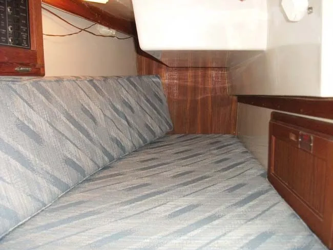 Slide: The Image of Interior of a 1990 Catalina 27 with blue upholstery. - 40