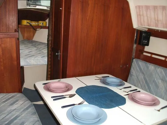 Slide: The Image of Interior of a 1990 Catalina 27 with set dining table. - 5