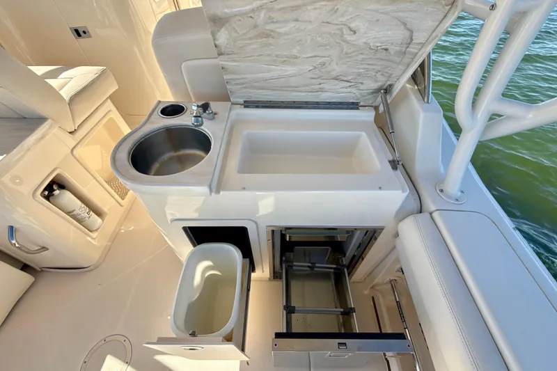 Slide: The Image of 2016 Grady-White Freedom 307 boat interior with ocean view and comfortable seating. - 23