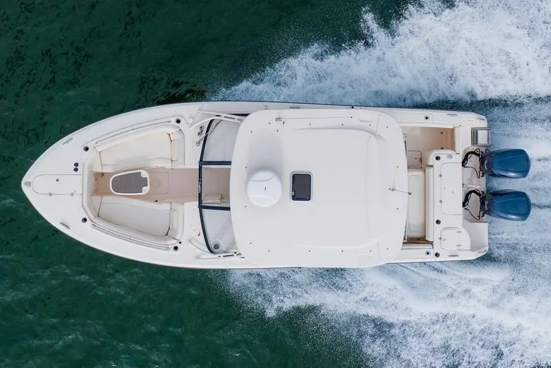 Slide: The Image of 2016 Grady-White Freedom 307 boat cruising on water, aerial view. - 32