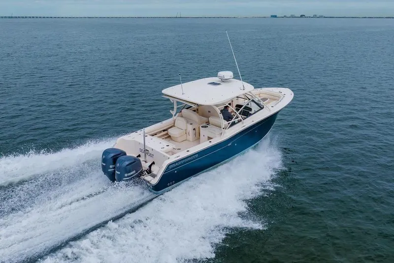 Slide: The Image of 2016 Grady-White Freedom 307 boat cruising on open water. - 35