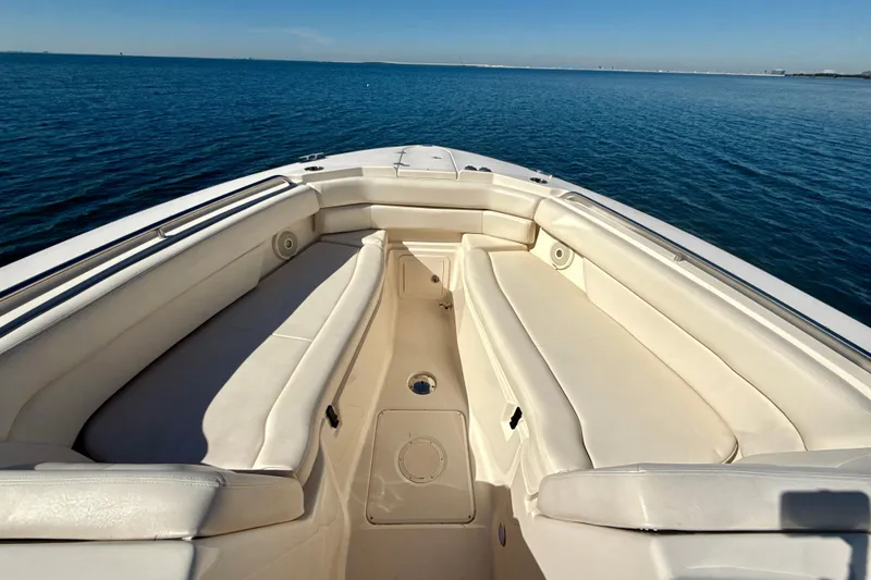 Slide: The Image of 2016 Grady-White Freedom 307 boat interior with helm, seating, and ocean view. - 4