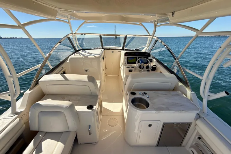Slide: The Image of 2016 Grady-White Freedom 307 boat interior with dual consoles and ocean view. - 6