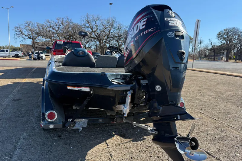 Slide: The Image of 2008 Ranger 198 VX boat with Evinrude 200 engine parked outdoors. - 13