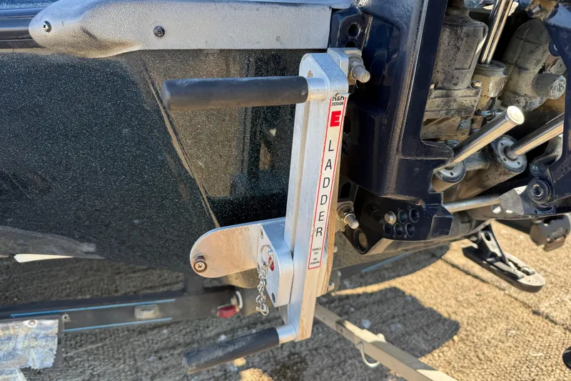 Slide: The Image of 2008 Ranger 198 VX boat ladder and engine detail on a sunny day. - 17