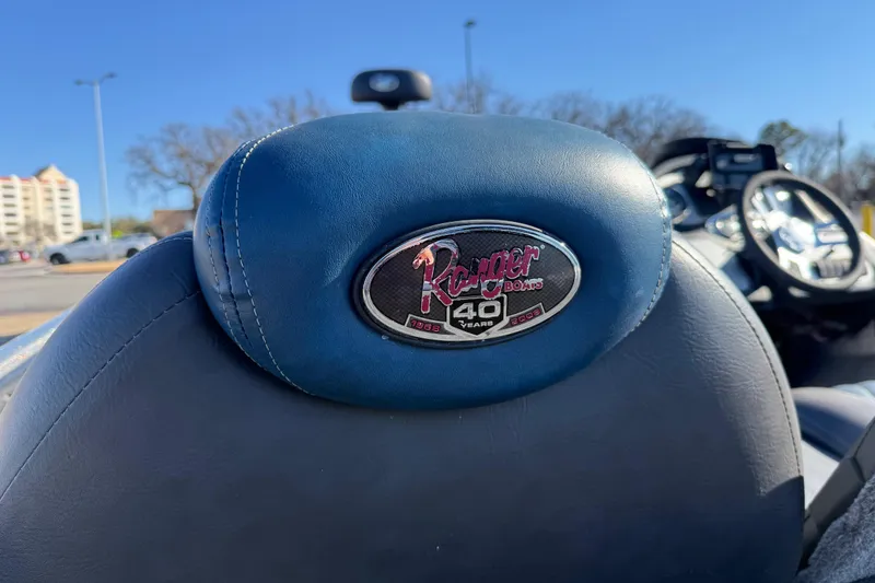 Slide: The Image of 2008 Ranger 198 VX boat seat with 40th anniversary logo, blue upholstery, sunny day. - 36