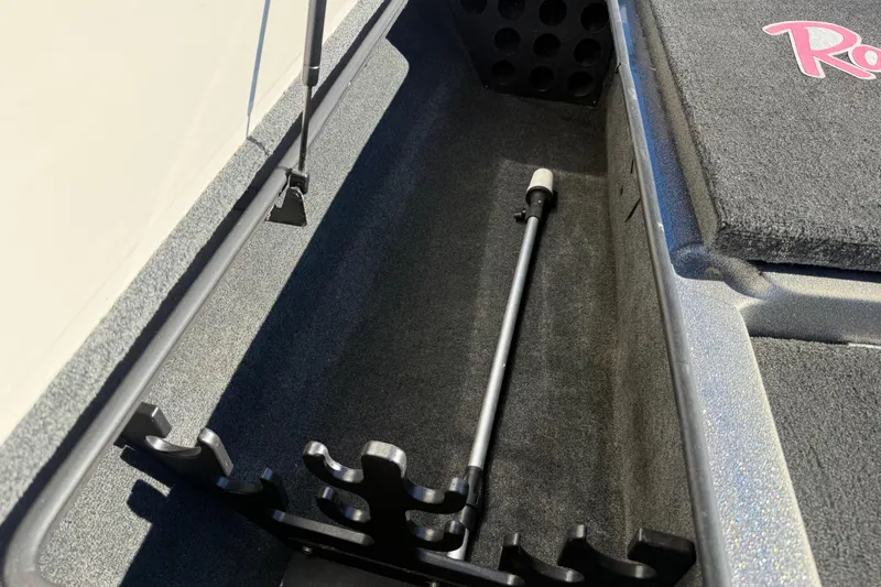 Slide: The Image of 2008 Ranger 198 VX boat rod storage compartment with organized holders. - 41