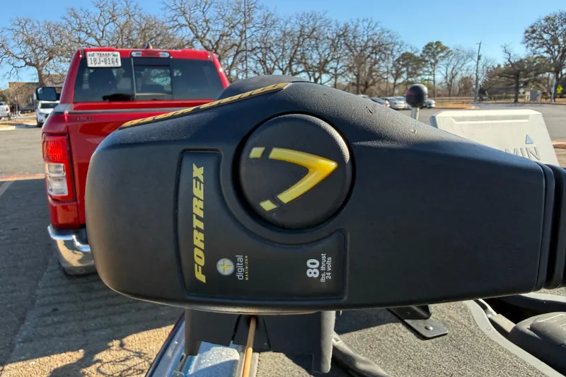 Slide: The Image of Close-up of Fortrex motor on 2008 Ranger 198 VX boat, red truck in background. - 48