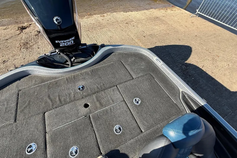 Slide: The Image of 2008 Ranger 198 VX boat with Evinrude 200 motor at a lakeside dock. - 59