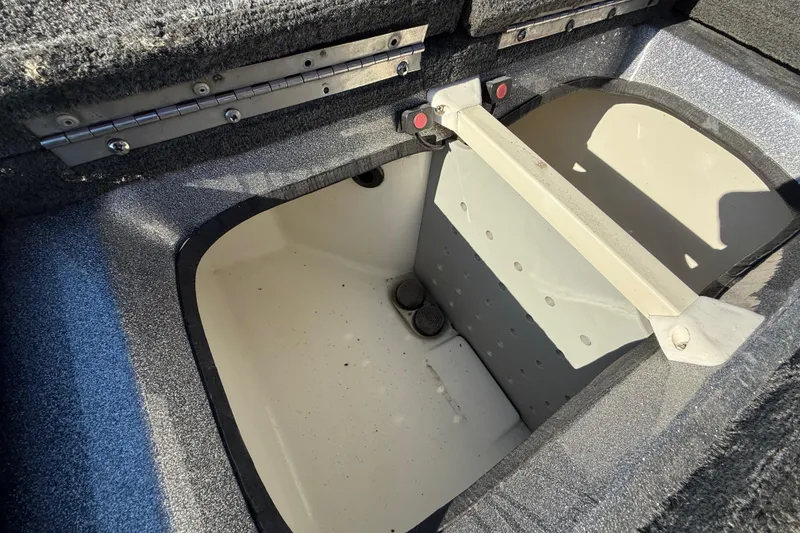 Slide: The Image of Open storage compartment in 2008 Ranger 198 VX boat, featuring a clean interior. - 61