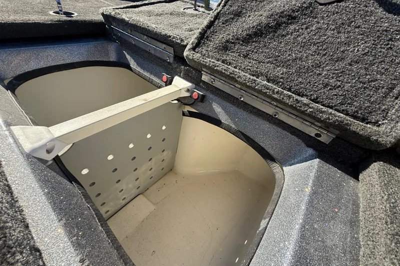 Slide: The Image of Open storage compartment in 2008 Ranger 198 VX boat, featuring carpeted interior. - 62