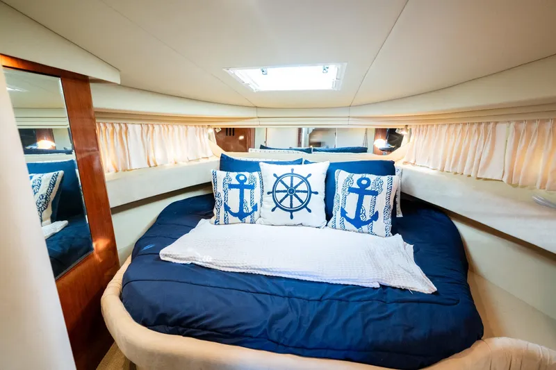Slide: The Image of Luxurious cabin interior of 2004 Sea Ray 380 Sundancer with nautical-themed decor. - 11