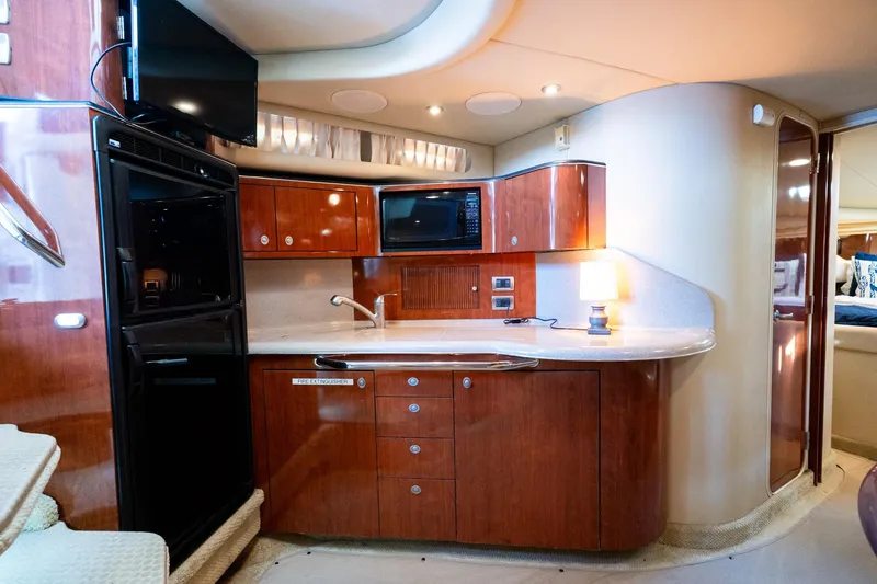 Slide: The Image of Luxurious 2004 Sea Ray 380 Sundancer yacht interior with modern kitchen amenities. - 13