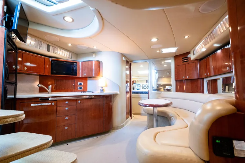 Slide: The Image of Luxurious interior of a 2004 Sea Ray 380 Sundancer yacht with modern amenities. - 14
