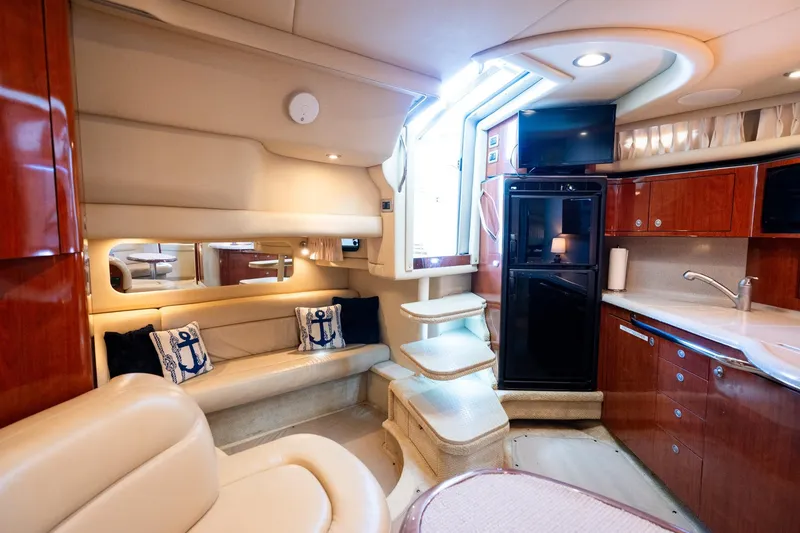 Slide: The Image of Luxurious interior of 2004 Sea Ray 380 Sundancer yacht with plush seating and modern amenities. - 16