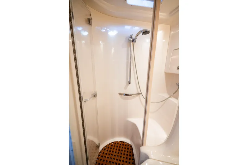 Slide: The Image of Shower area in 2004 Sea Ray 380 Sundancer yacht, featuring sleek design and modern fixtures. - 17