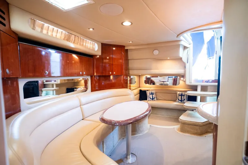 Slide: The Image of Luxurious interior of 2004 Sea Ray 380 Sundancer yacht with elegant seating and wood finishes. - 18
