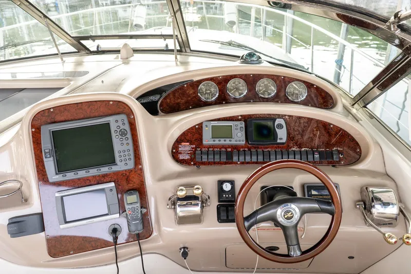 Slide: The Image of Control panel of a 2004 Sea Ray 380 Sundancer boat with navigation instruments. - 20