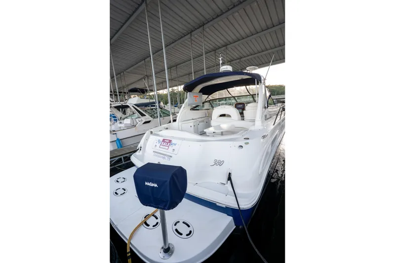 Slide: The Image of 2004 Sea Ray 380 Sundancer yacht docked, featuring a "For Sale" sign. - 26